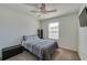 This bedroom has a ceiling fan and a window with blinds at 1183 Cabot Cliffs Dr, Daytona Beach, FL 32124