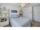 Cozy bedroom featuring a ceiling fan, window and decorative shelving at 1183 Cabot Cliffs Dr, Daytona Beach, FL 32124
