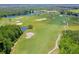 Aerial view of a beautiful golf course with lush fairways and scenic water hazards at 1183 Cabot Cliffs Dr, Daytona Beach, FL 32124