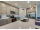 Bright kitchen featuring gray cabinetry, stainless steel appliances, and a large island at 1183 Cabot Cliffs Dr, Daytona Beach, FL 32124