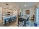 Modern kitchen with an island, pendant lighting, and a combined dining area at 1183 Cabot Cliffs Dr, Daytona Beach, FL 32124