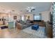 Open-concept living room featuring wood-look tile, comfortable seating, and stylish decor at 1183 Cabot Cliffs Dr, Daytona Beach, FL 32124