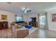 Bright living room with a plush sectional sofa, patterned rug, and a media console at 1183 Cabot Cliffs Dr, Daytona Beach, FL 32124