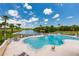 A view of a large outdoor community pool featuring plenty of lounge seating and clear water at 1183 Cabot Cliffs Dr, Daytona Beach, FL 32124
