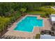 Resort-style community pool with plenty of seating and a cabana for relaxing in the Florida sunshine at 1183 Cabot Cliffs Dr, Daytona Beach, FL 32124