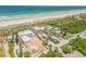 Picture of the home with beach access, lush landscape and convenient parking at 1209 N Atlantic Ave, New Smyrna Beach, FL 32169