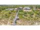 Aerial view showcasing a coastal community with beachfront access and lush surroundings at 1209 N Atlantic Ave, New Smyrna Beach, FL 32169
