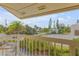 Charming balcony view showcasing lush greenery and neighborhood scenery at 1209 N Atlantic Ave, New Smyrna Beach, FL 32169