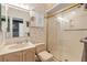 Clean bathroom featuring a vanity, toilet, and glass-enclosed shower at 1209 N Atlantic Ave, New Smyrna Beach, FL 32169