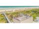 Spectacular beach view from the deck with a spiral staircase and a wooden walkway at 1209 N Atlantic Ave, New Smyrna Beach, FL 32169