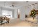 Spacious bedroom featuring large closet mirrors, ample natural light, neutral carpeting, and an adjacent bathroom entrance at 1209 N Atlantic Ave, New Smyrna Beach, FL 32169