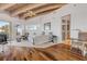 Bright bedroom with a ceiling fan, hardwood floors, and ocean views at 1209 N Atlantic Ave, New Smyrna Beach, FL 32169