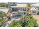 Aerial view of the home showcasing its modern architecture, surrounding landscape, and outdoor living spaces at 1209 N Atlantic Ave, New Smyrna Beach, FL 32169