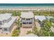 Unique, three-story home with a curved roof, a three car garage, and beachfront access and views at 1209 N Atlantic Ave, New Smyrna Beach, FL 32169
