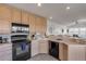 Bright kitchen with modern appliances and seamless access to the living room area at 1209 N Atlantic Ave, New Smyrna Beach, FL 32169