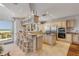 Open kitchen design features a large island with cooktop, bar seating, stainless appliances, and ocean views at 1209 N Atlantic Ave, New Smyrna Beach, FL 32169