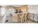 Kitchen with a breakfast bar and wicker barstools at 1209 N Atlantic Ave, New Smyrna Beach, FL 32169