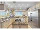 Gourmet kitchen with granite counters, custom cabinets, stainless appliances, and ocean views at 1209 N Atlantic Ave, New Smyrna Beach, FL 32169