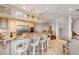 Well-appointed kitchen features stainless appliances, a large island with cooktop, and adjacent bar seating at 1209 N Atlantic Ave, New Smyrna Beach, FL 32169