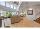 Spacious living room featuring tile floors, modern furniture, and expansive windows with ocean views at 1209 N Atlantic Ave, New Smyrna Beach, FL 32169