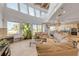 Open concept living room with tile floors, modern furniture, fireplace, and ocean views at 1209 N Atlantic Ave, New Smyrna Beach, FL 32169