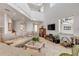 Large living area with a fireplace, entertainment center, comfortable seating, and high ceilings at 1209 N Atlantic Ave, New Smyrna Beach, FL 32169