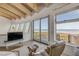Cozy living room with comfortable seating, a TV, and panoramic ocean views at 1209 N Atlantic Ave, New Smyrna Beach, FL 32169