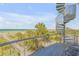 Breathtaking ocean views from a deck with a spiral staircase and beach access at 1209 N Atlantic Ave, New Smyrna Beach, FL 32169