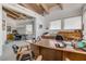 Well-lit office space featuring beamed ceilings and ample storage, plus views into the home at 1209 N Atlantic Ave, New Smyrna Beach, FL 32169