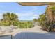 Inviting outdoor patio with seating area surrounded by lush tropical landscaping and ocean views at 1209 N Atlantic Ave, New Smyrna Beach, FL 32169