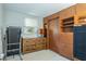 Bright bedroom with a storage cabinet, dresser, and a treadmill at 1284 Vanderbilt Dr, Ormond Beach, FL 32174