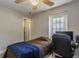 Comfortable bedroom featuring a ceiling fan, and a computer desk at 1284 Vanderbilt Dr, Ormond Beach, FL 32174