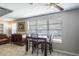 Dining room with wood table set, natural light, and classic decor at 1284 Vanderbilt Dr, Ormond Beach, FL 32174
