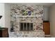 Close up of the detailed white brick fireplace with mantle and enclosed firebox at 1284 Vanderbilt Dr, Ormond Beach, FL 32174