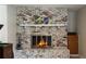 Close up of the detailed white brick fireplace with mantle and enclosed firebox at 1284 Vanderbilt Dr, Ormond Beach, FL 32174