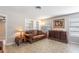 Living room with leather sofa, built-in shelving, and a classic ambiance at 1284 Vanderbilt Dr, Ormond Beach, FL 32174