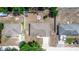 Aerial view of homes showing surrounding neighborhood and lawn with a fire pit with chairs at 1326 13Th St, Orange City, FL 32763