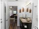Bathroom featuring granite countertop and wooden planters, leading to the living room at 1326 13Th St, Orange City, FL 32763
