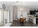 Inviting dining area with a round table and modern lighting at 1326 13Th St, Orange City, FL 32763