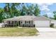 Inviting single-story home with a two-car garage and manicured lawn at 1326 13Th St, Orange City, FL 32763