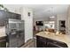 Modern kitchen featuring stainless steel appliances, granite countertops, and dark wood cabinets at 1326 13Th St, Orange City, FL 32763