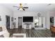 Cozy living room featuring modern flooring and sliding glass doors leading to the outdoor area at 1326 13Th St, Orange City, FL 32763