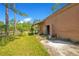 Exterior side view of the barn, complemented by a well-maintained yard and fencing, for outdoor storage at 140 Rodeo Rd, Ormond Beach, FL 32174