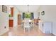 Traditional dining room with tile flooring, a patterned rug, and matching curtains at 140 Rodeo Rd, Ormond Beach, FL 32174