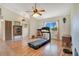Exercise room featuring wood floors, a ceiling fan, and a treadmill at 140 Rodeo Rd, Ormond Beach, FL 32174