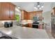 Traditional kitchen featuring wood cabinetry, stainless steel appliances, and a neutral countertop at 140 Rodeo Rd, Ormond Beach, FL 32174