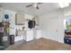 Functional laundry room with washer, dryer, utility sink, and storage cabinets, and water heater at 140 Rodeo Rd, Ormond Beach, FL 32174