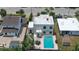 Aerial view of backyard with pool and patio at 145 S Peninsula Dr, Daytona Beach, FL 32118