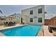 Private backyard pool area with a table and chairs, perfect for outdoor entertaining and relaxation at 145 S Peninsula Dr, Daytona Beach, FL 32118