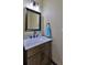 Half bathroom with decorative mirror, vanity with marble countertop, and modern fixtures, offering a fresh aesthetic at 145 S Peninsula Dr, Daytona Beach, FL 32118